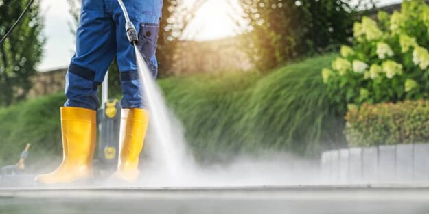 Man Using a Tampa Pressure Cleaning